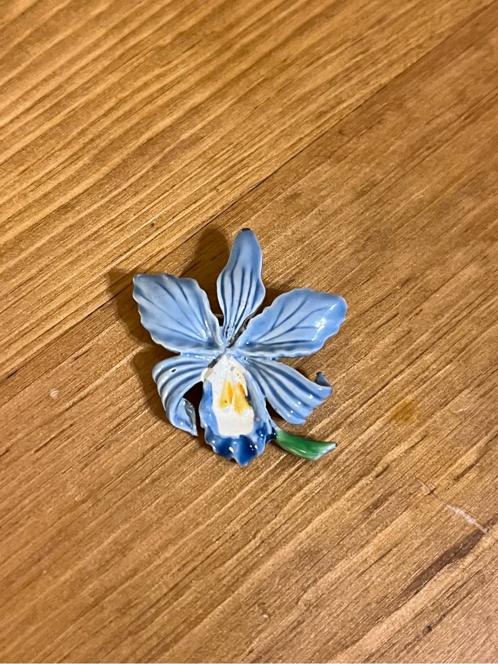Vintage tiny blue orchid flower brooch has a roll over clasp 1 1/2 “